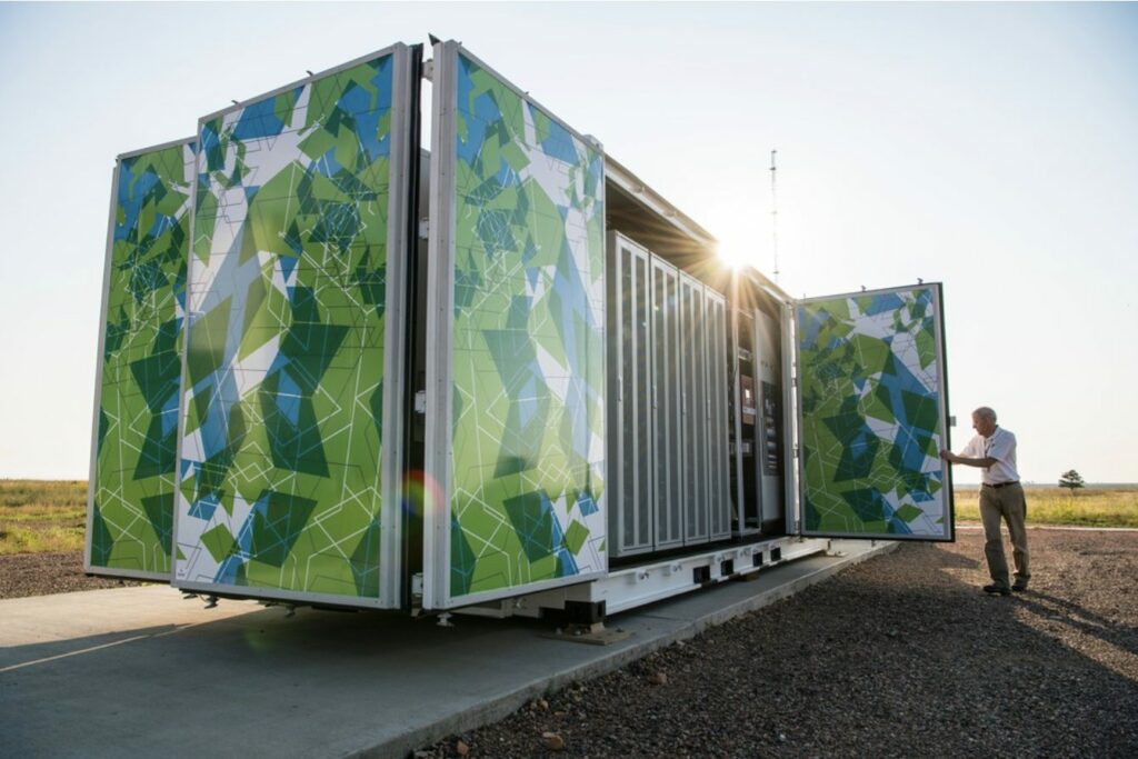 August 29, 2017 - Sr. Project Leader, Jim Green, opens the doors on the Flex manufactured battery enclosure,1 MW, 1 MWh rating, using lithium ion batteries from LG, at the Battery Energy Storage System, owned and operated by NREL for grid integration research at the NWTC. (Photo by Dennis Schroeder / NREL)