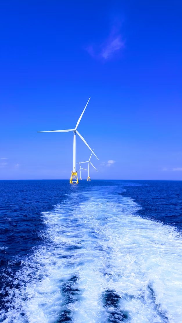 Image of Offshore Wind Turbines off the coast of Block Island, RI by Shaun Dakin via Unsplash (2017).