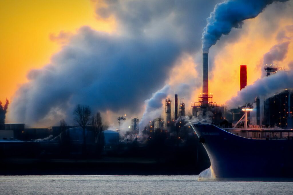 Greenhouse gas emissions caused by factory pollution, taken by Chris LeBoutillier in 2021 via Unsplash.