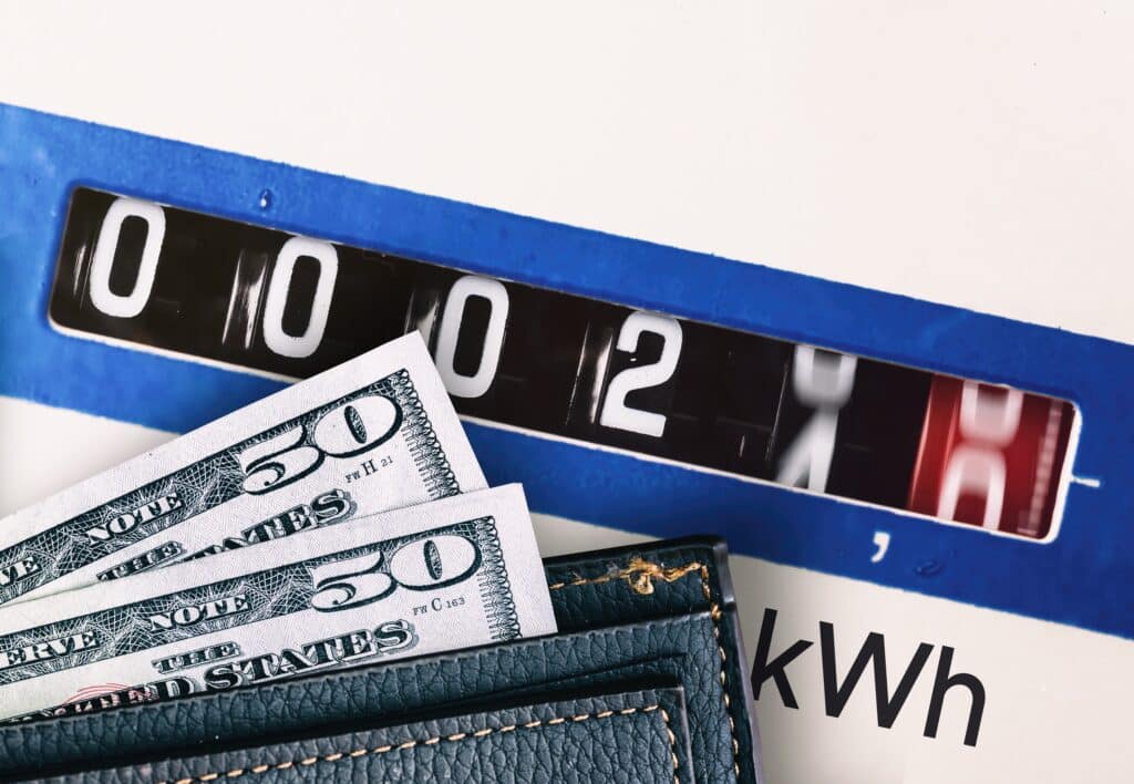Wallet with American currency and electricity meter, Shutterstock ID#2115414875