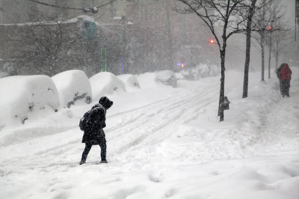 Bronx woman crossing the street during a blizzard in New York City, Shutterstock ID#366949991